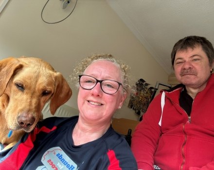 A Hounds for Heroes great south run participant with assistance dog and partner